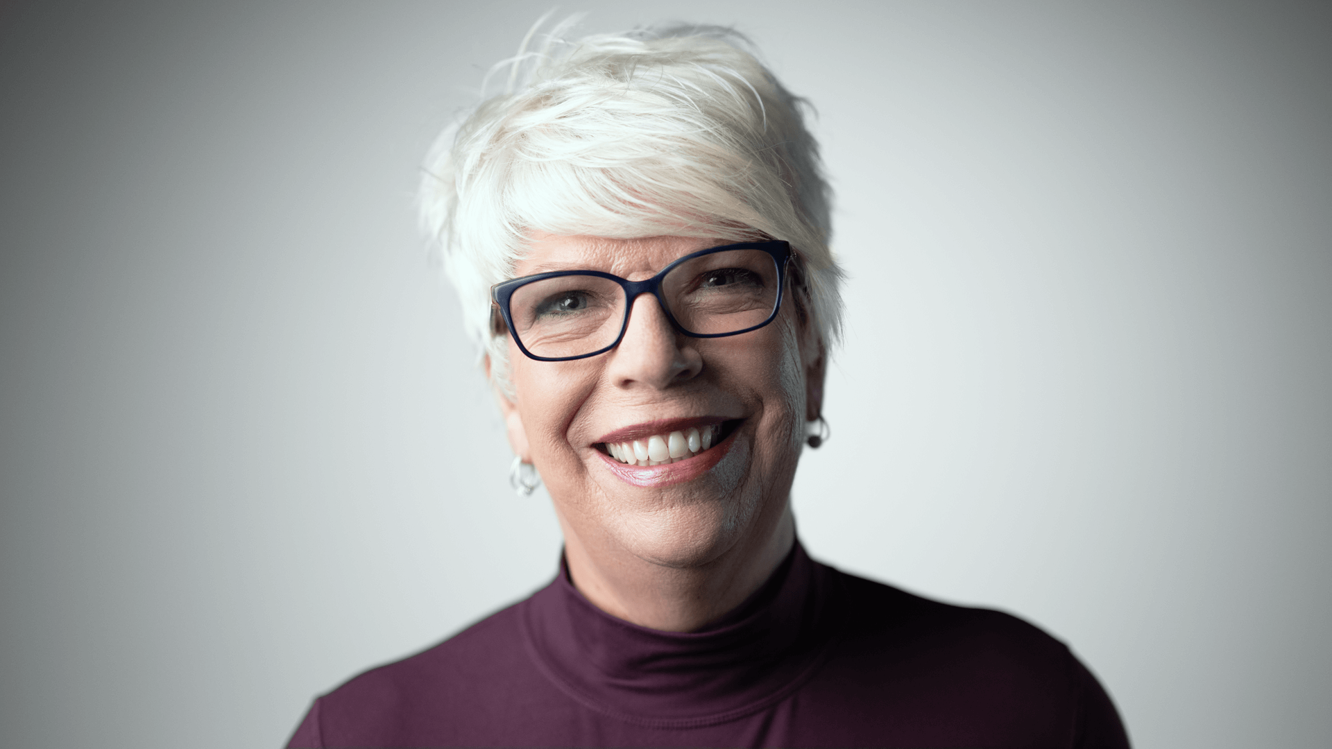Headshot of Dana-Farber Brigham Cancer Center patient Karen, click to watch her testimonial.