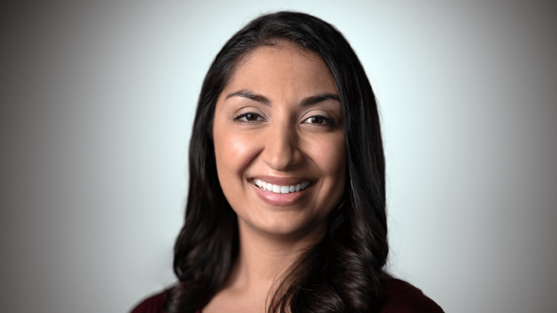 Headshot of Dana-Farber Brigham Cancer Center patient Lucy, click to watch her testimonial.