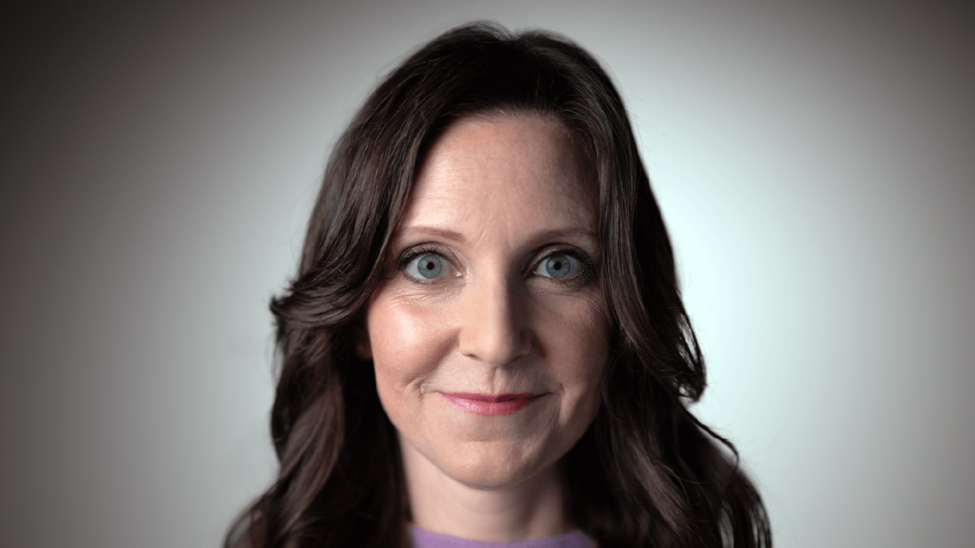 Headshot of Dana-Farber Brigham Cancer Center patient Maggie, click to watch her testimonial.